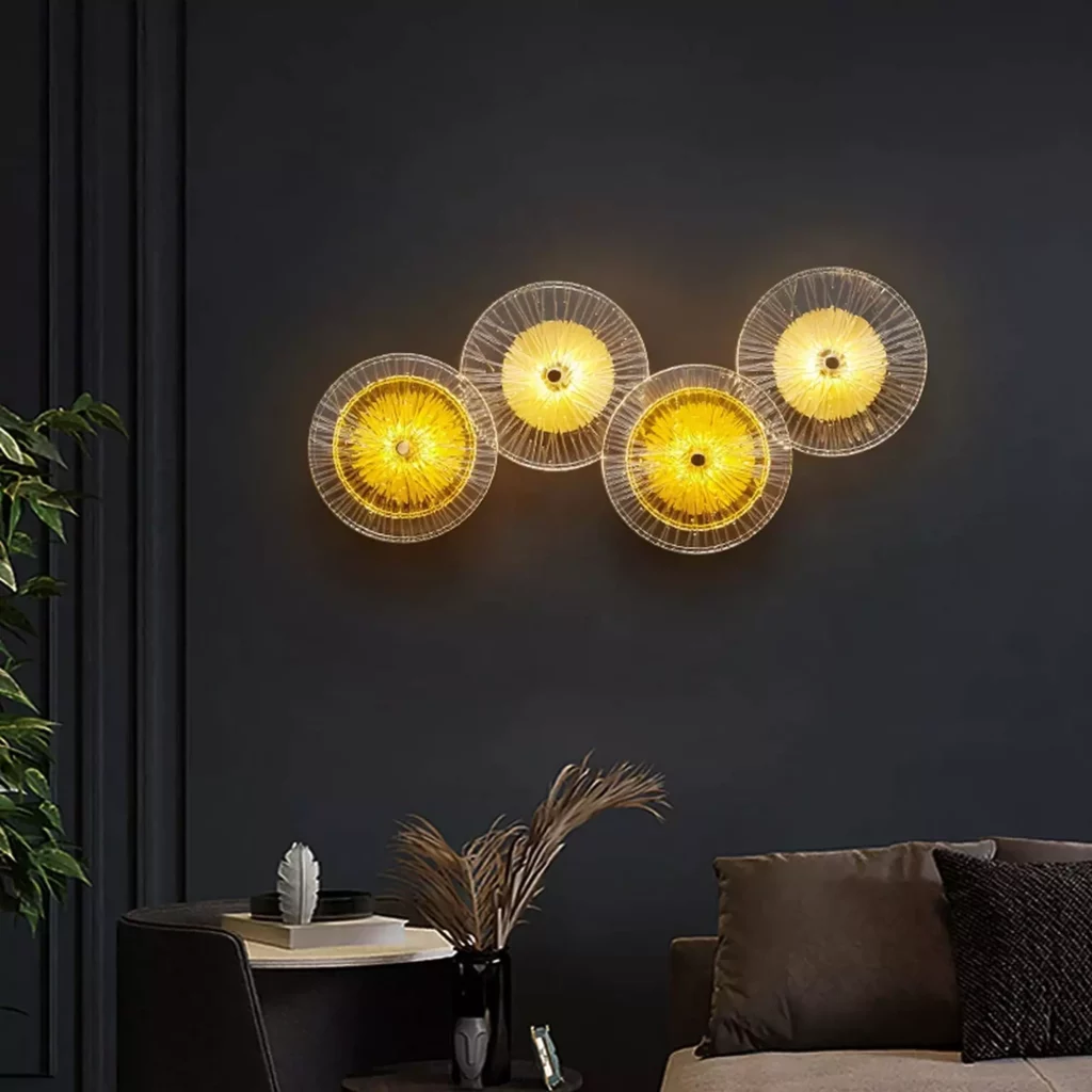 Gold Round Shape LED Wall Lamp featuring multiple circular glass shades casting warm ambient light in a modern living room setting