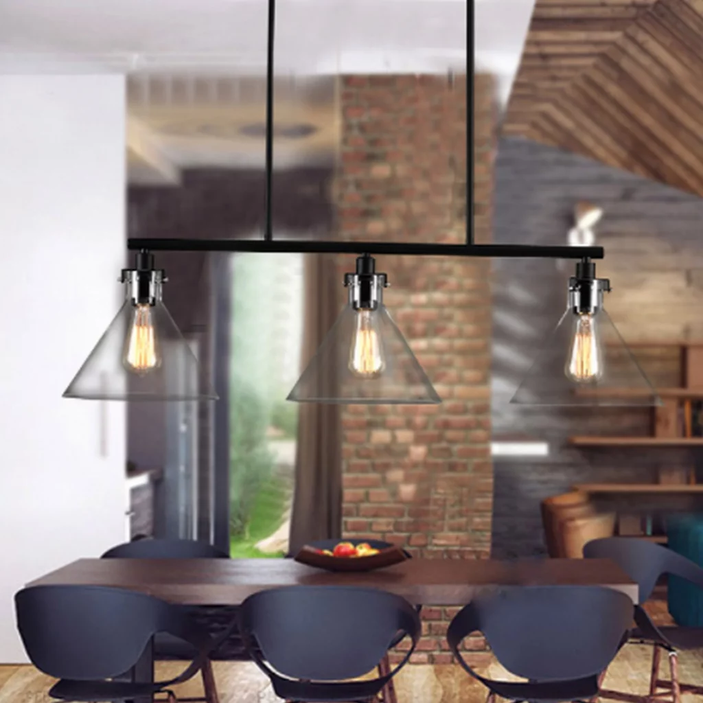 American Style Black Retro Chandelier with three clear glass shades and exposed Edison bulbs over a modern dining table.