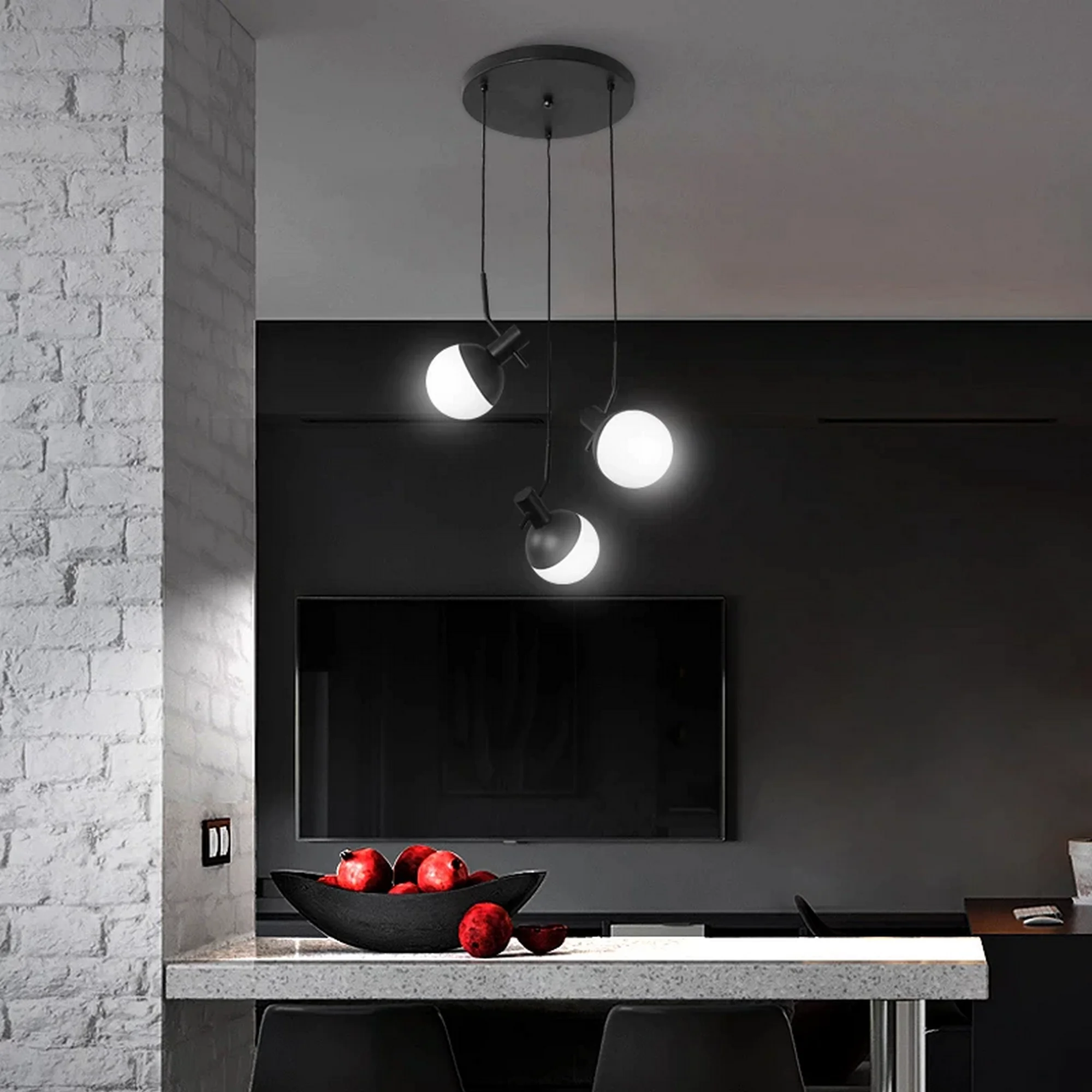 Modern Black Metal Three Heads Chandelier with glowing white globe shades suspended over a sleek kitchen counter.