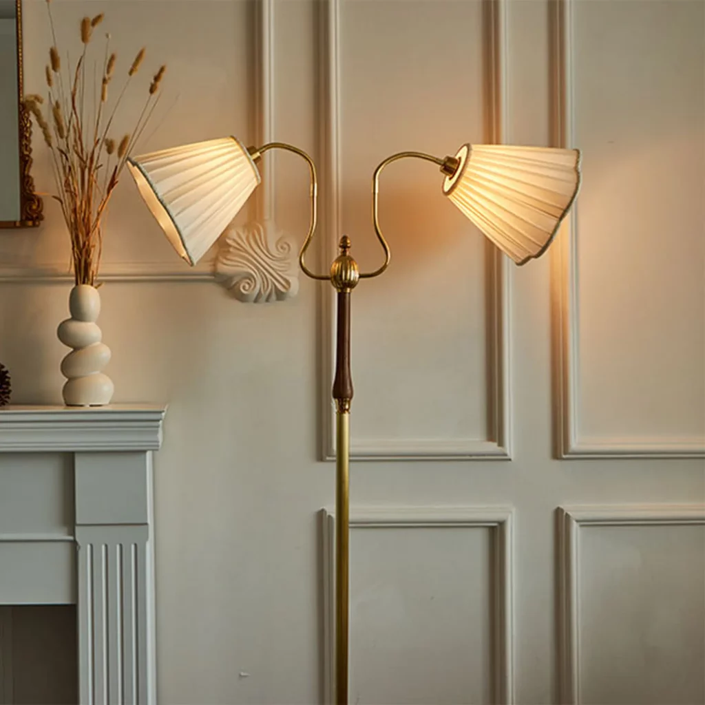 Elegant Modern Floor Lamp with dual pleated shades and brass finish styled in a classic living room with paneled walls and fireplace mantel