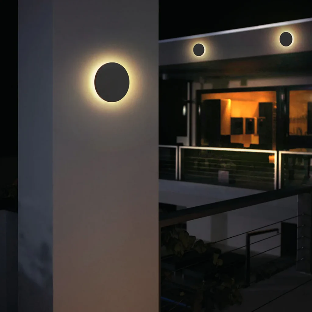 Round Shape Waterproof Outdoor Lamp with minimal round design illuminating a modern outdoor space at night
