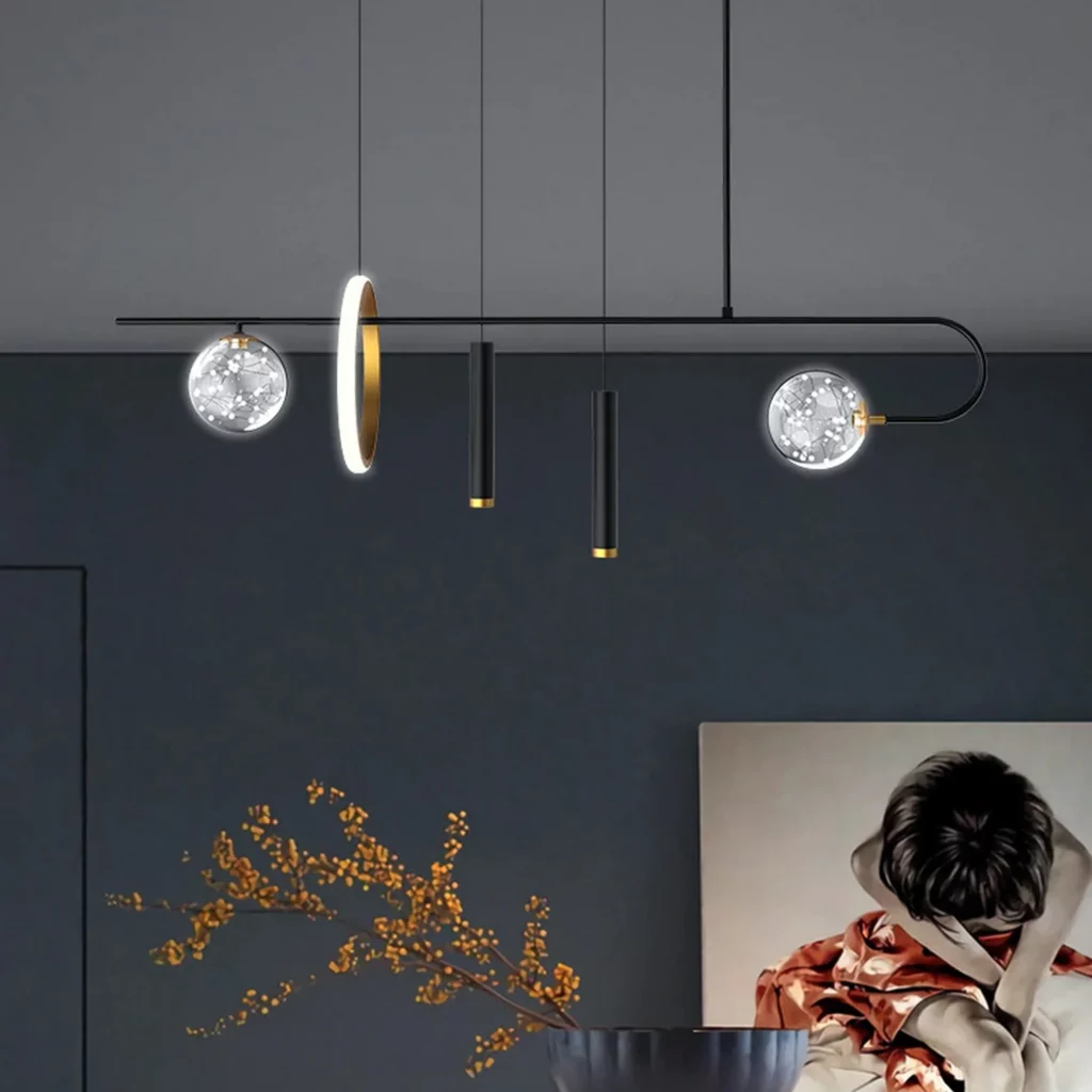 Avant garde chandelier with a black horizontal bar luminous gold ring and two sparkling glass sphere ornaments