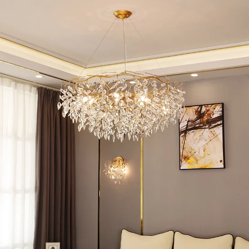 Sparkling Laurel Crystal Chandelier featuring gold-finished branches draped with teardrop crystal leaf accents and glowing bulbs.