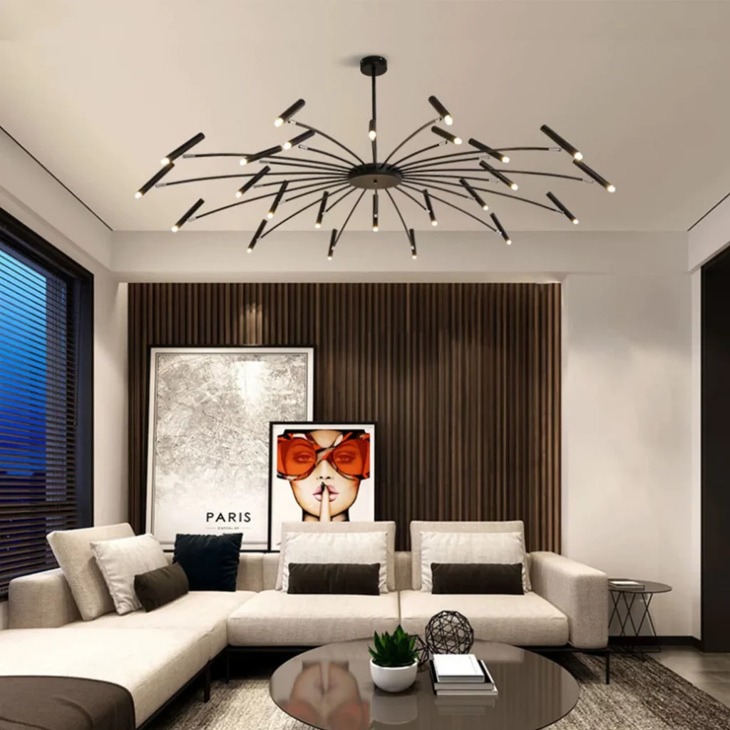 A Nordic Candlebera Black White chandelier with numerous thin, radiating arms and small LED tips, lighting a modern living room.