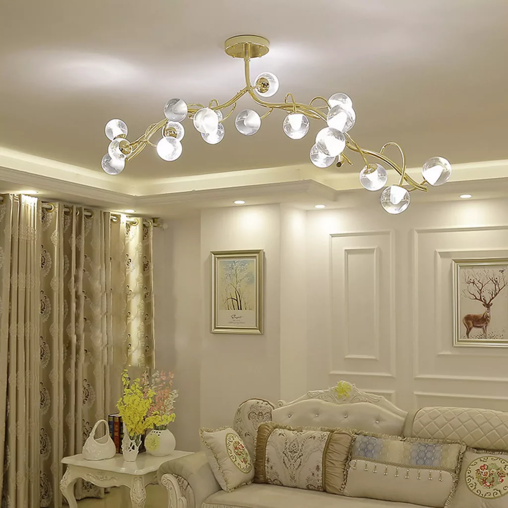 Elegant living room with classic decor, featuring a Glass Globe Design Branch Chandelier with gold finish and glowing clear globes illuminating the space.