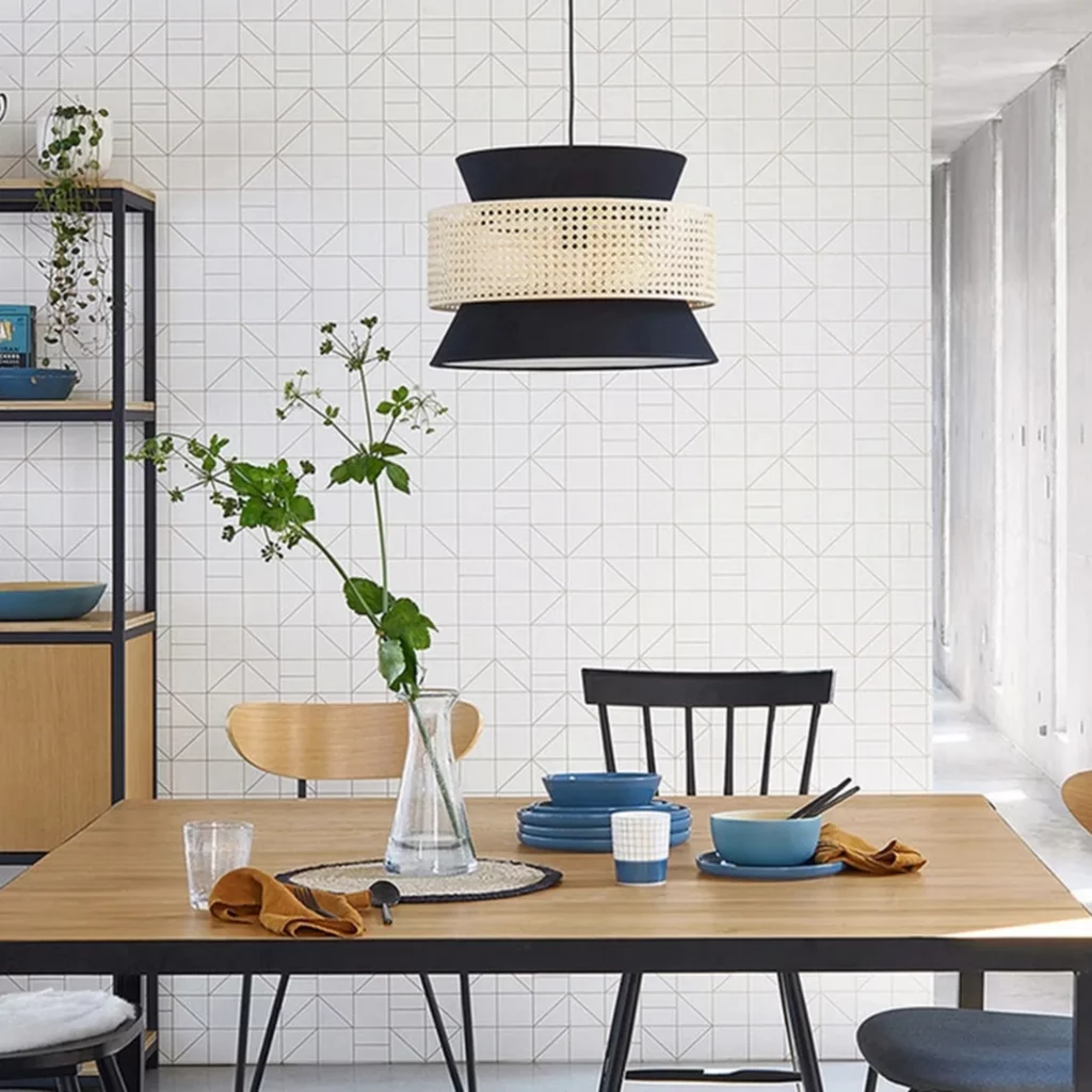 Japanese Design Rattan Pendant Light with woven rattan shade and black accents above a modern dining table.