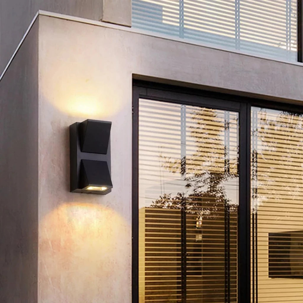 Double Head Projection LED Outdoor Lamp on modern exterior wall casting warm up and down light.