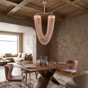 Modern dining room with a sculptural pink chandelier, wooden ceiling, and a large wooden table set for a meal.