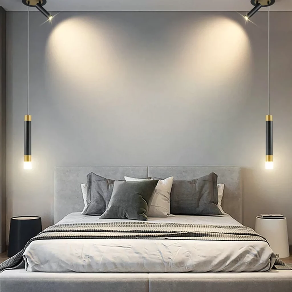 Long Bar with Spotlight LED Pendant Light casting focused light over a modern bed with a minimalist design in a stylish bedroom