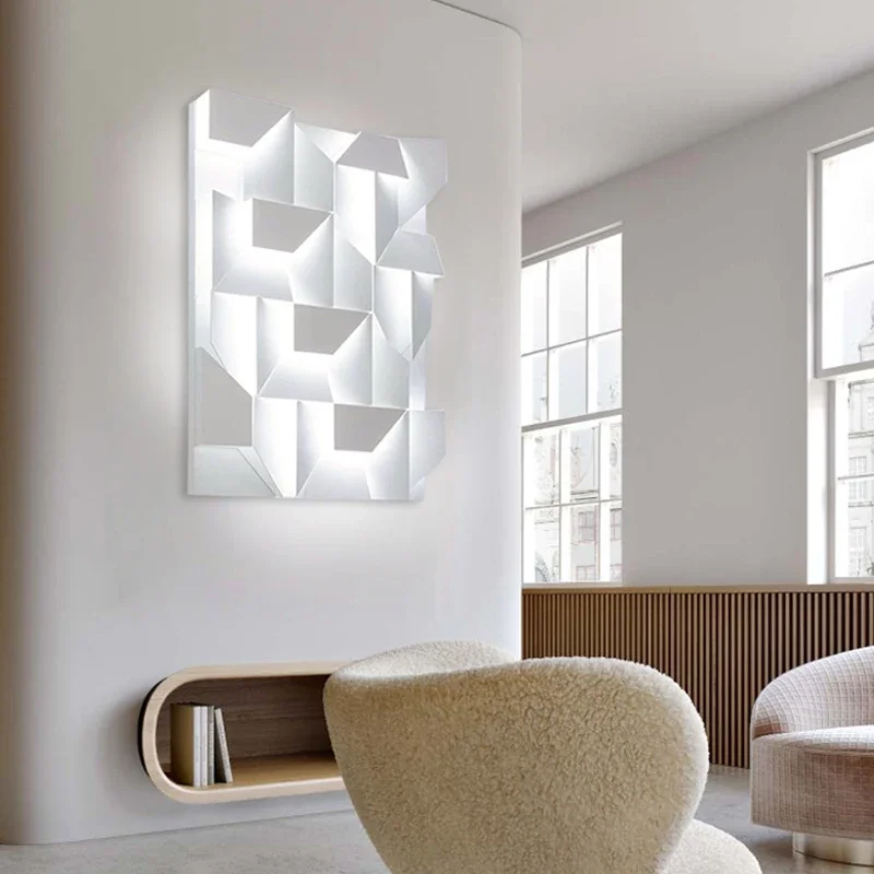Wall Shadows Grand Wall Light with a geometric design, casting unique shadows and adding a modern touch to a minimalist living room.
