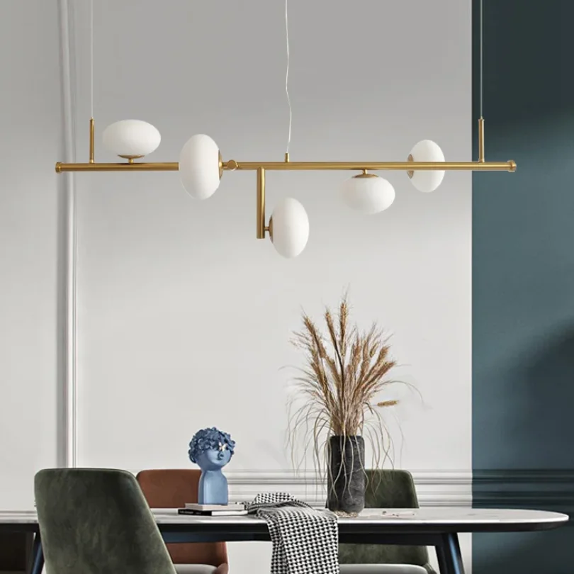 Mami LED Linear Suspension with elongated golden finish for your kitchen space